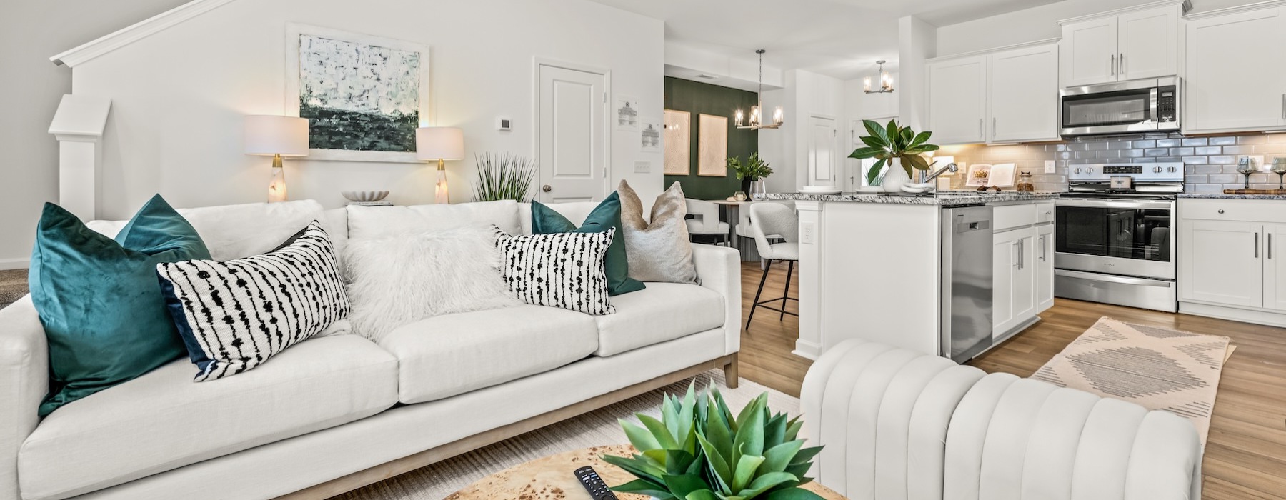 a living room with a couch and a plant